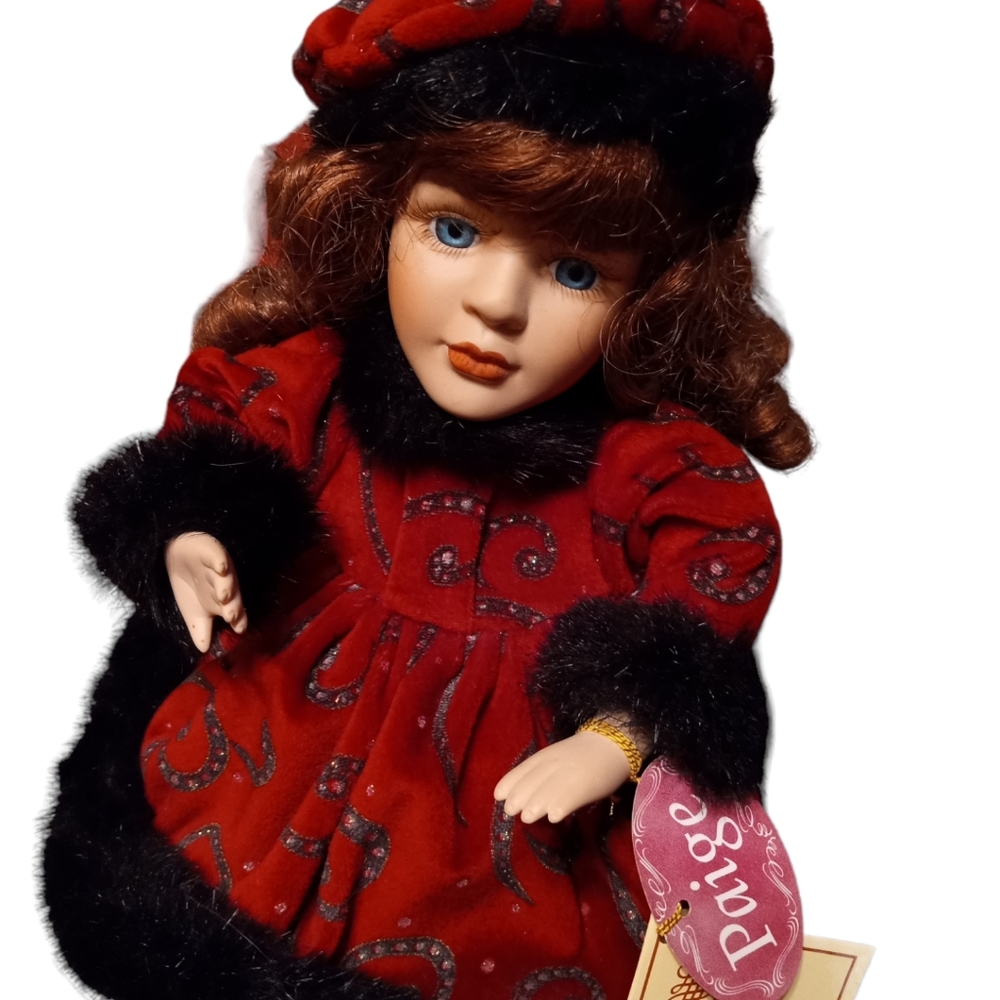 Musical Porcelain Doll. "Paige", is a beauty. With a certificate of authenticity